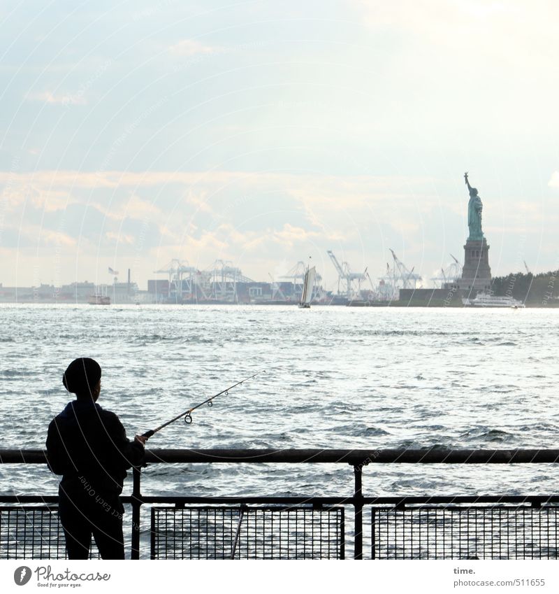 Fishing for Freedom Human being 1 Water Sky Autumn Beautiful weather Coast River Hudson River New York City Port City Handrail Statue of Liberty Observe