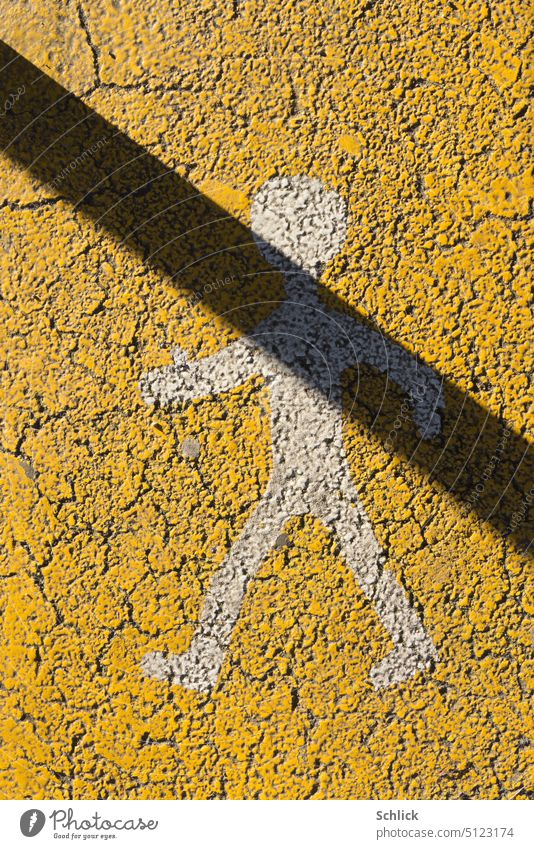 Pedestrian hostile shadow Asphalt Yellow symbol Shadow Drop shadow Diagonal Street Transport Traffic infrastructure Sign Colour photo Man little man White