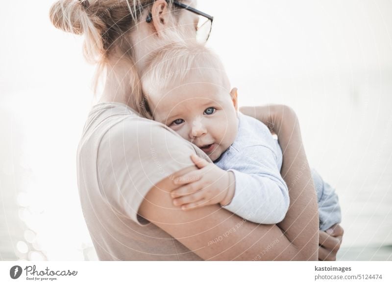 Beautiful Mother And Baby outdoors. Mum and her Child together enjoying sunset woman mother beautiful little fun mom child parent family care love childhood kid