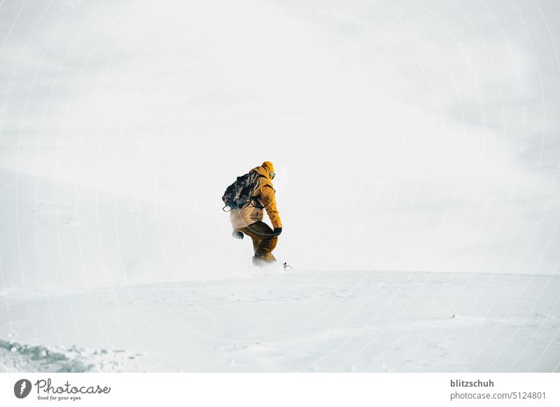 Snowboarder in deep snow in Grisons , Lenzerheide powder freeride Deep snow Switzerland Suisse alps Alps Snowboarding freeriding Winter Leisure and hobbies