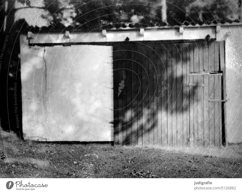 Wooden gate with tree shade shed door Storage shed Barn Hut Wall (building) Wooden door Entrance Flake Building Garage Shadow Light Old dilapidated Past