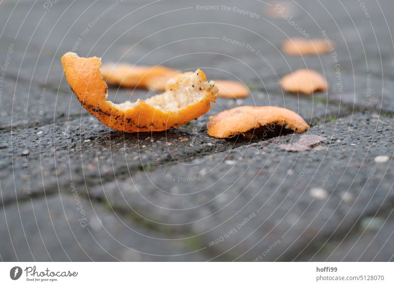 Orange peels on a sidewalk waste Trash bequest Shackled Throw away Reckless Dispose of Waste management leave it at Environmental protection