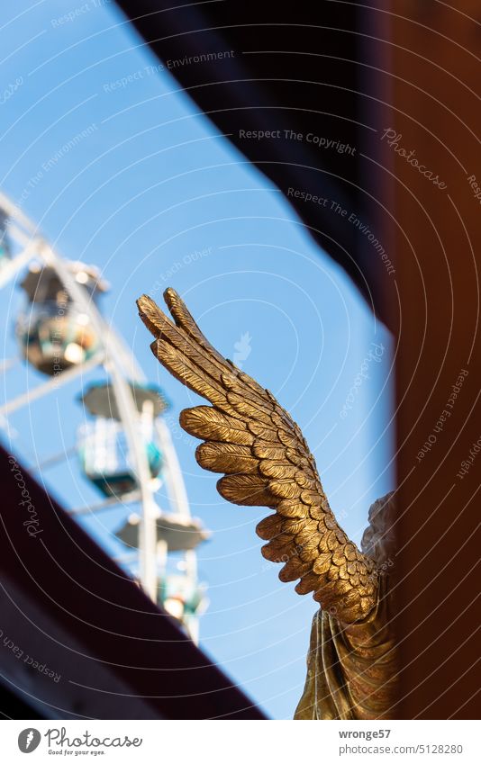 Angel at the fair Angel figure funfair Christmas Fair Ferris wheel Fairs & Carnivals Carousel Sky Joy Theme-park rides Guardian angel pleasure Attraction