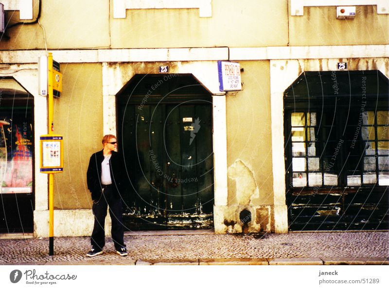 On the streets of Lisbon Tram Wall (building) Man Sunglasses Portugal Sidewalk Entrance Street Perspective
