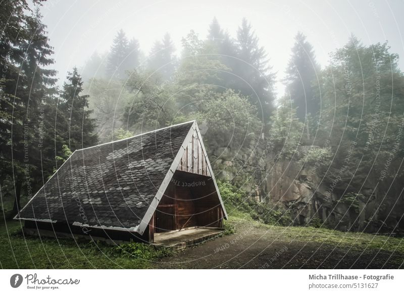 Wooden hut in fog Mountain lake at the Ebertswiese Thuringia Thueringer Wald Hut wafts of mist Fog Forest trees Rock Wall of rock stones Landscape Hiking Day