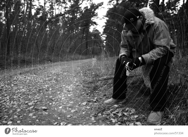 Don't give up. . . Grief Calm Man Baseball cap Forest White Exterior shot Portrait photograph Pants Leaf Autumn Sadness Wait Silver black grey Lanes & trails