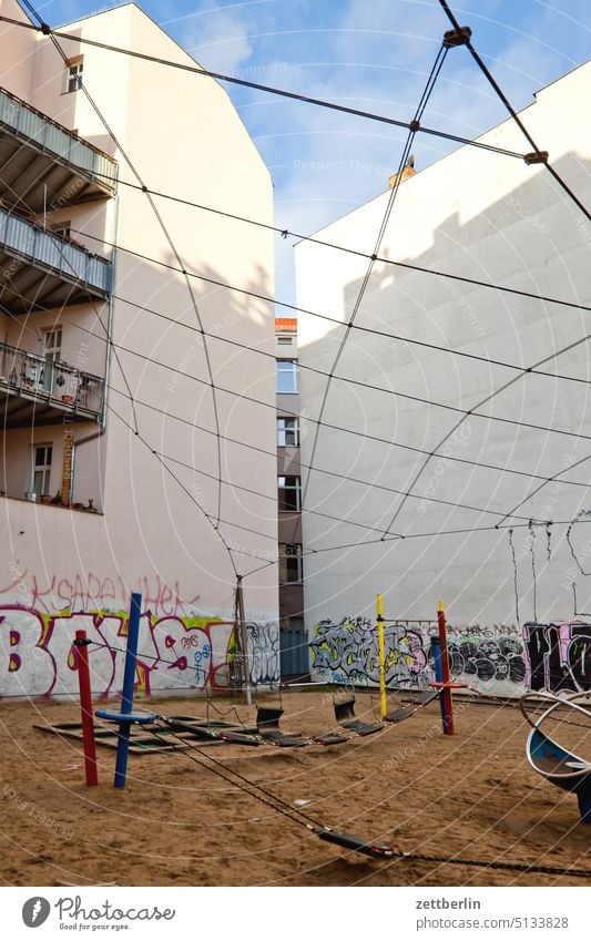 Playground in the backyard again Old building on the outside Fire wall Facade Window Worm's-eye view House (Residential Structure) Sky Sky blue rear building