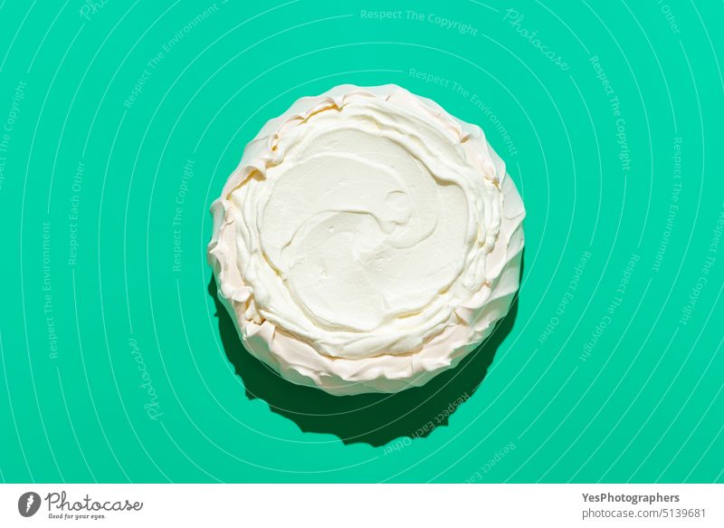 Pavlova cake in bright light, isolated on a green background above australian baked color comfort copy space cream crispy crust cuisine delicious design dessert