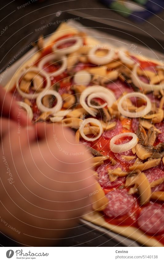 Pizza is topped Coating Allocate Eating hunger onions Salami mushrooms Delicious kiln Self-made Food Kitchen Dough Cooking Meal Nutrition Italian Tasty