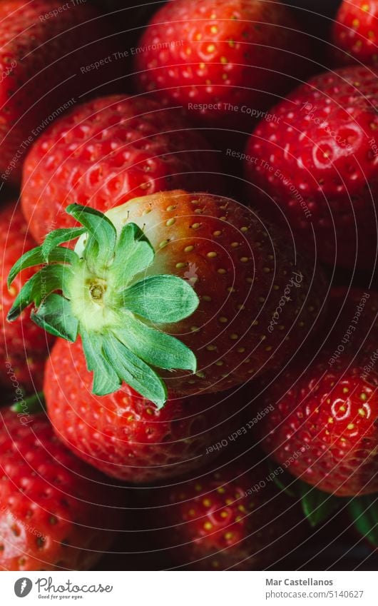 Macro photography of ripe strawberries. Backgrounds and textures. Vertical photo. macro copy space top view fruit red food vitamins delicious appetizing natural