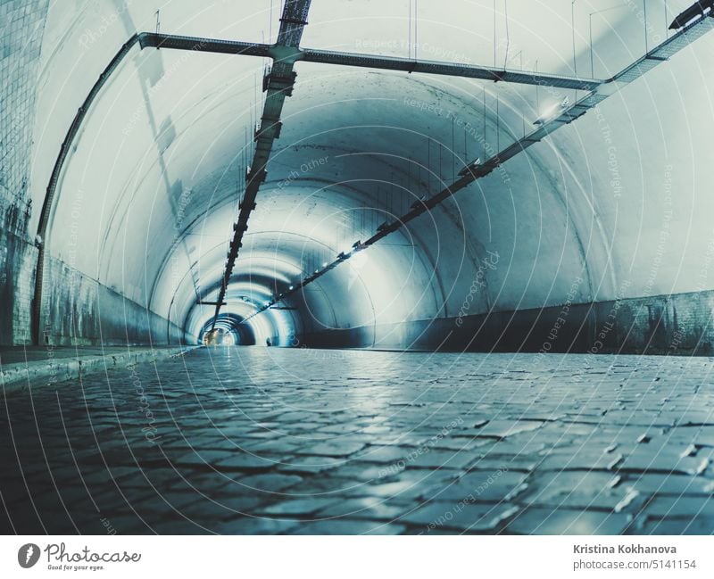 Highway tunnel. Interior of urban tunnel without traffic in nught with blue lights. Rome, Italy night road background fast highway line motion speed street