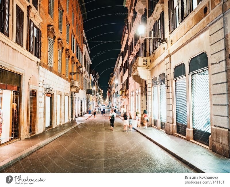 Typical italian street at night in the centre of the Old Town. Rome, Italy. Lot of illuminated boutiques and stores. city europe travel urban architecture