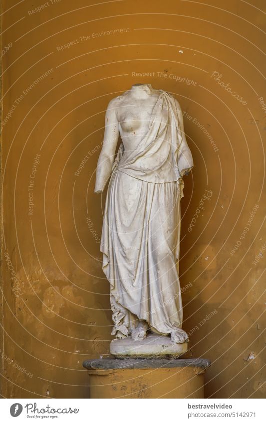 Nymph marble statue detail in neoclassical temple - Tempietto del Cagnola in Guastalla Gardens Milan, Italy. Neoclassical temple headless statue temple on park