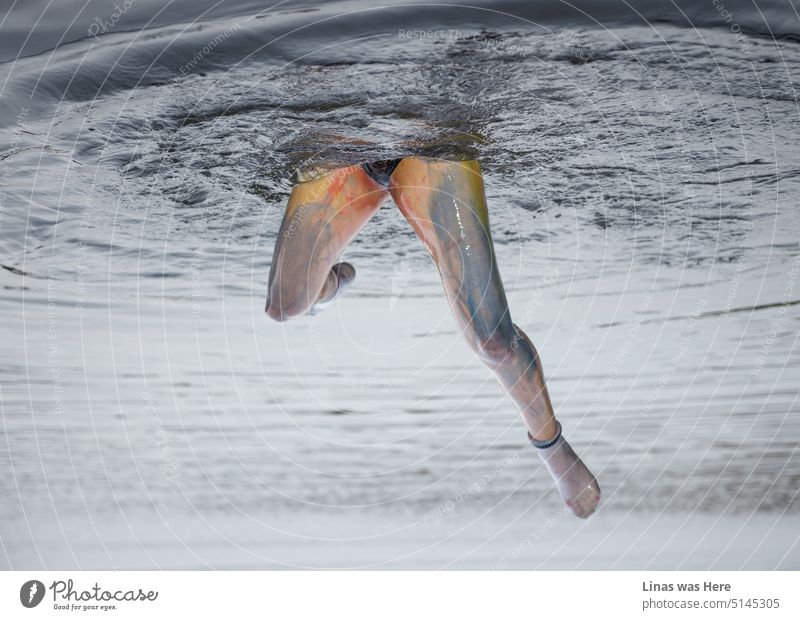 It’s all about the angle and the perspective. Reversed image is showing pretty legs all colorful and raised from the water. Upside down picture is odd and mysterious. Though nobody drowned while making this photo.
