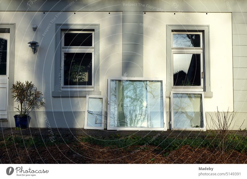 Old windows with white frames after the change to heat-insulating windows with triple-layer glazing of an old residential house in Oerlinghausen near Bielefeld in the Teutoburg Forest in East Westphalia-Lippe