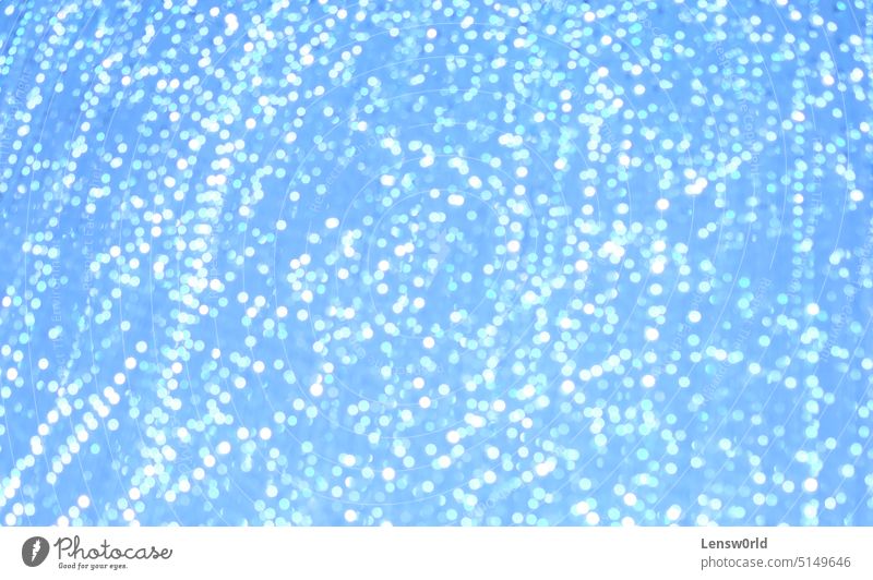 Blurred out lights creating an abstract pattern backdrop background blue blurred lights bokeh bokeh background bright glitter shine shiny texture white