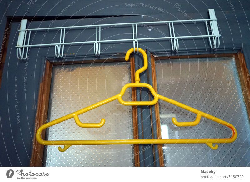 Yellow plastic clothes hanger in the style of the seventies a country house on the Black Sea in Inkumu on the Black Sea coast in the province of Bartin in Turkey