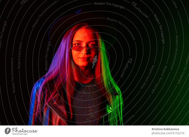 Female teenager in neon light - a Royalty Free Stock Photo from Photocase