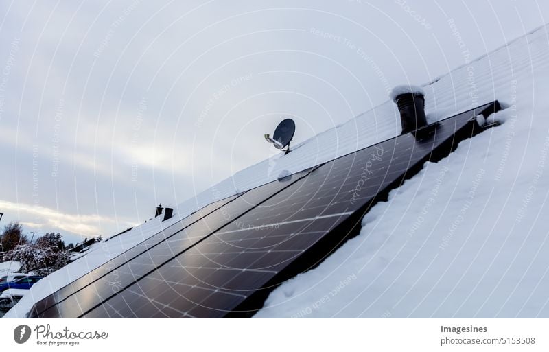 Solar system on the roof with snow in winter. Remove snow from