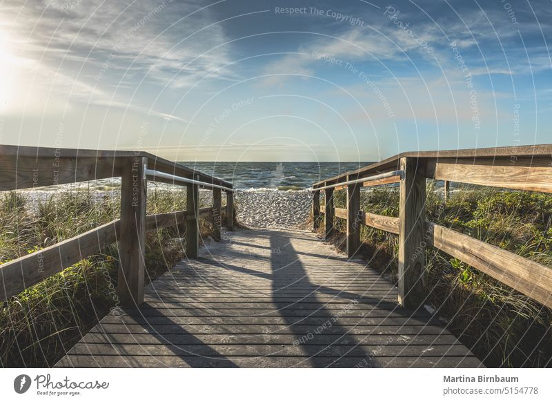 Boardwalk to the beach on Sanibal Island, Florida vacations travel sanibal landscape ocean blue coast tropical water sky pier florida sunset outdoor nature