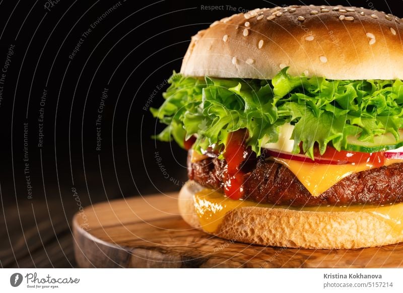 Tasty burger with smoke, fast food concept. Fresh homemade grilled hamburger salad lettuce meat tomato beef onion cheese closeup tasty american unhealthy