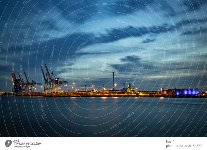 Hamburg port facility at dusk Harbour Elbe River Evening Dusk Sunset blue hour Clouds in the sky coast cranes Container terminal container port Port of Hamburg