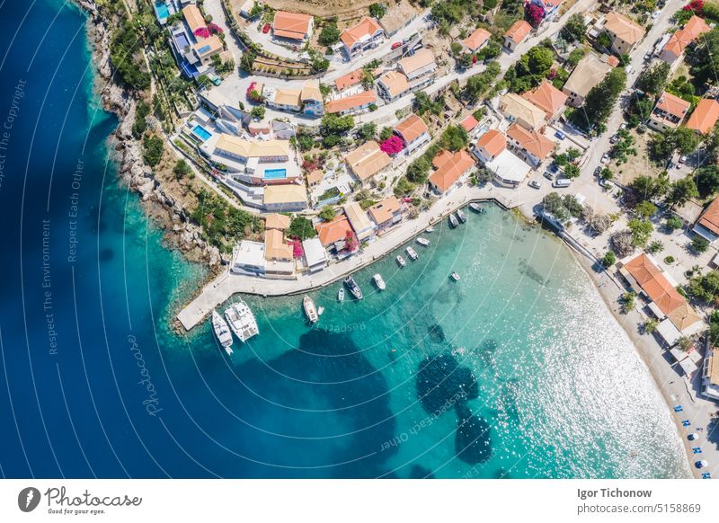 Assos picturesque fishing village from above, Kefalonia, Greece. Aerial drone view. Sailing boats moored in turquoise bay greece kefalonia assos sea summer