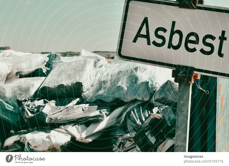 Asbestos on a sign. Asbestos on a landfill. Ecological concept. asbestos Clue Signage Container waste containers construction sector peril corrupted Disposal