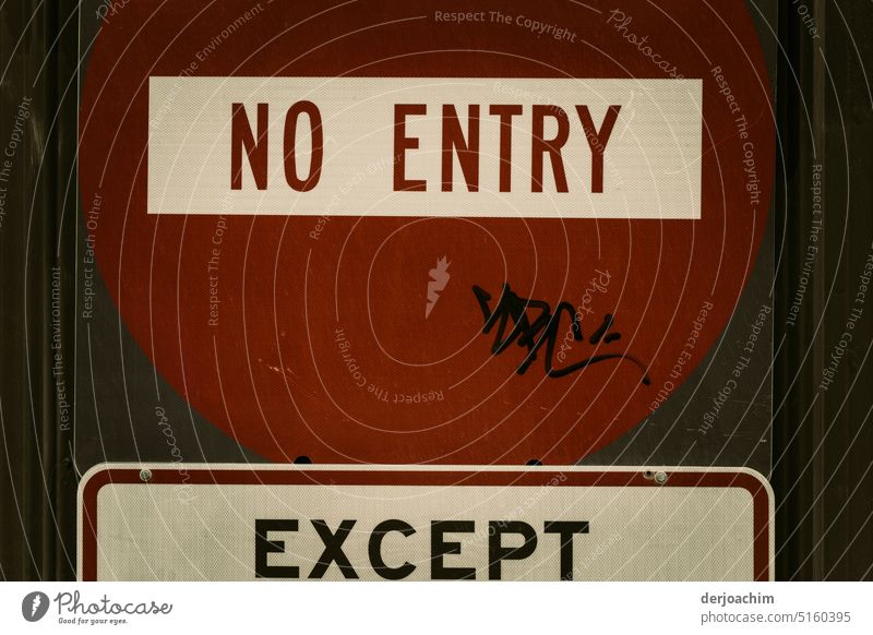 Large red sign with red letters : NO ENTRY , Under the sign in black letters : EXCEPT , Signs and labeling Signage Deserted Exterior shot Colour photo