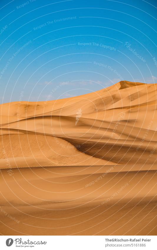 Dune against blue sky - a Royalty Free Stock Photo from Photocase