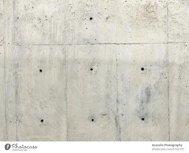 Concrete wall background with drilled holes. color closeup nobody crumpled monochrome damaged scratched smudged grey structure surface white modern art detail