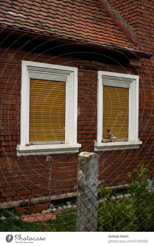 Brick facade with closed shutters Roller shutter Closed Window double Couple In pairs Venetian blinds Facade Front garden settlement Village Fence Property