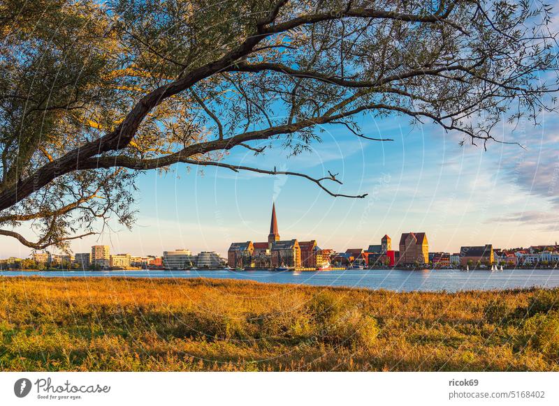 View over the Warnow to the Hanseatic City of Rostock in the evening Warnov River city harbour Mecklenburg-Western Pomerania Town Church Petri church