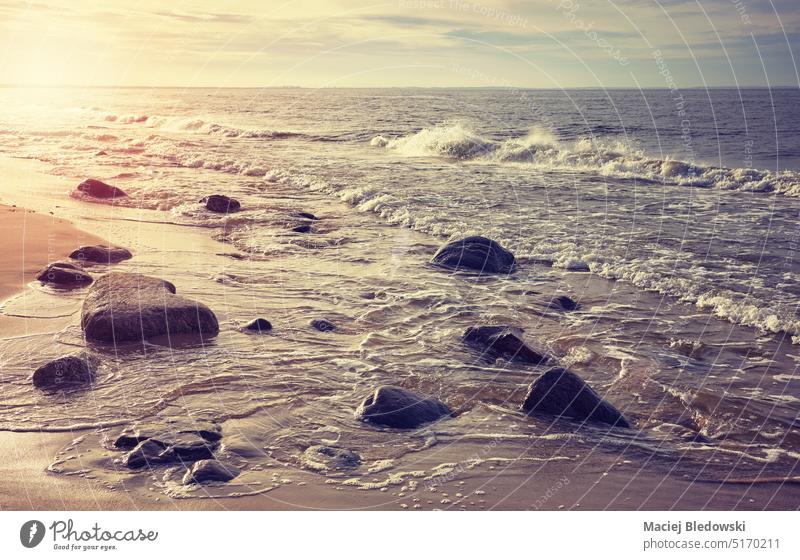 Baltic sea beach at sunset, color toning applied, Poland. water nature landscape Europe sky Miedzyzdroje toned filtered retro effect horizon sunrise holiday