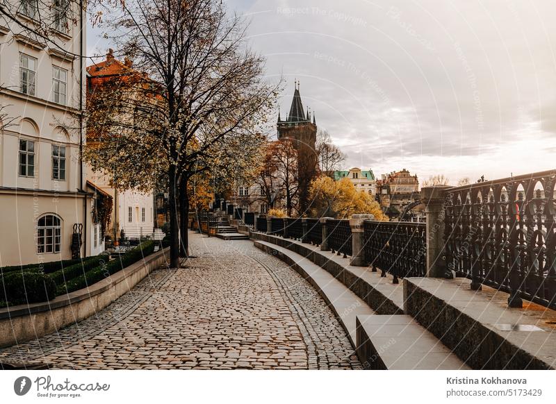 Old european cobblestone embankment over Vltava river. Cozy empty cityscape. architecture building old prague capital house street tourism town czech landmark