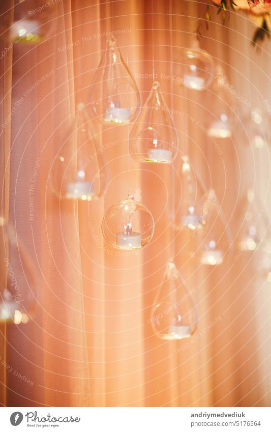 Wedding arch decoration. close-up of glass balls with candles and pink cloth. selective focus wedding crystal love white ceremony celebration background