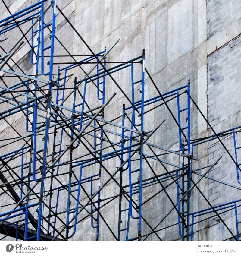 Constructive Wall (barrier) Wall (building) Scaffold Rod Ladder Scaffolding Concrete Metal Tall Gloomy Blue Dimension Perspective Line intricately Direct