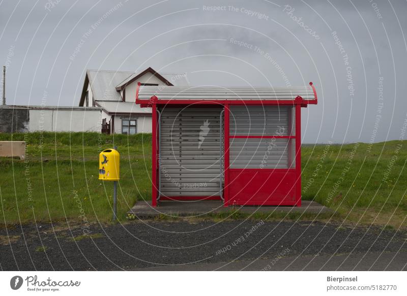 Red bus stop shelter and yellow wastebasket in Hafnir, Iceland Stop (public transport) Bus stop shelter Wastepaper basket Yellow Transport Passenger traffic