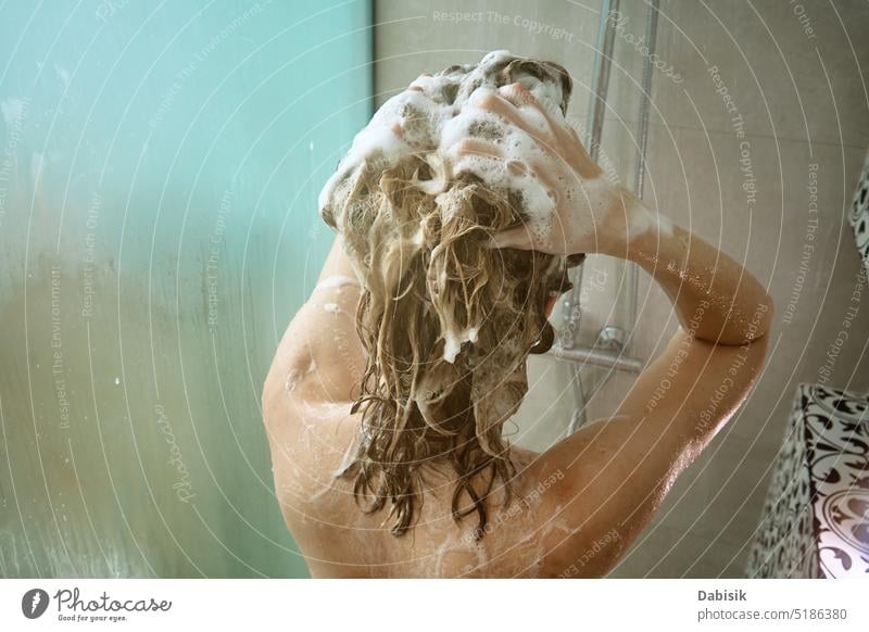 Back view of woman taking a shower in bathroom take back hair hygiene body head clean cabin shampoo washing candid care beauty caucasian enjoy female fresh girl