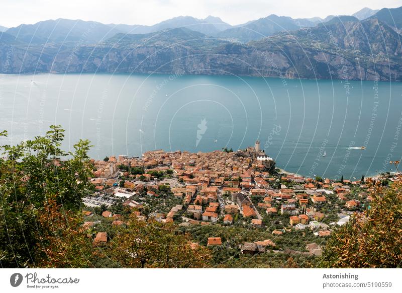 Block on Malcesine Lake Garda Vantage point Landscape Nature mountain Roof Water Large bank Town Peak Klainstadt Italy Above Under Blue Red Green boat Sky