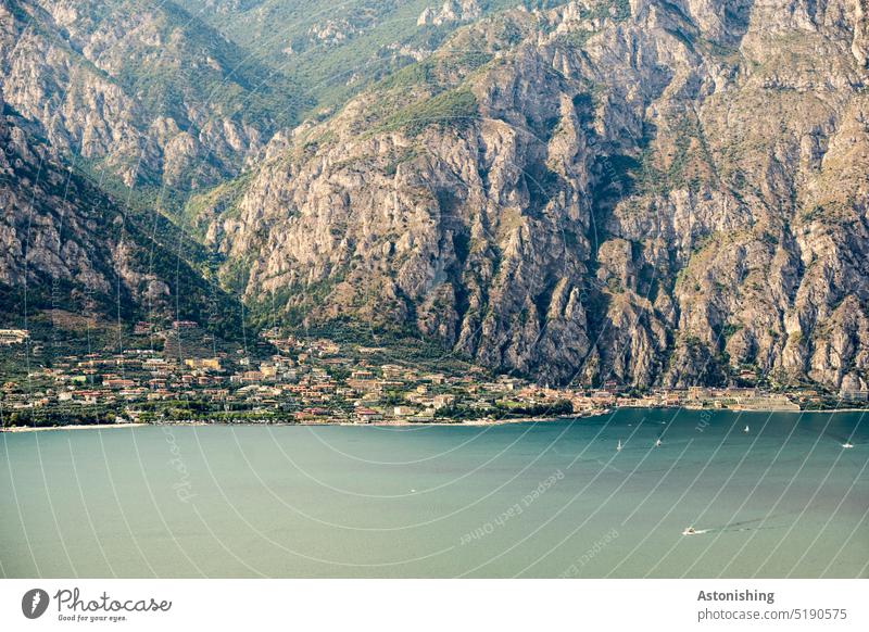 View of Limone sul Garda, Lake Garda, Italy 3 Lemone bank coast mountain Tall height Water Town Steep Large Horizon Clouds Vantage point wave Blue Green Nature