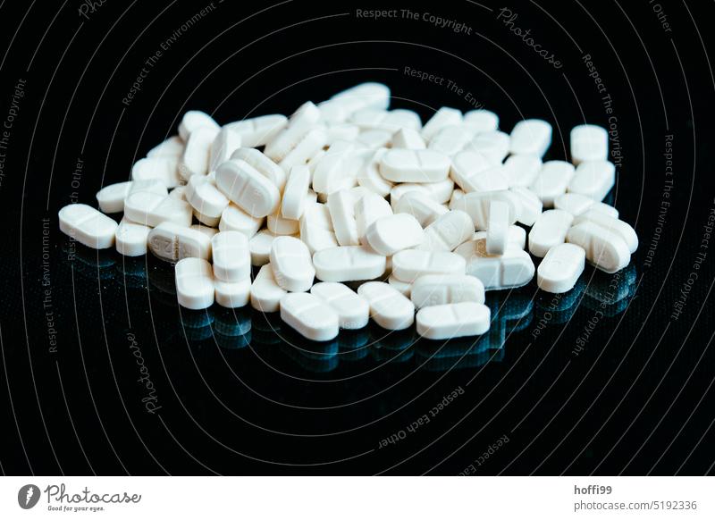 white pills on black background Pills abstract abstract pattern addiction chemistry chronically ill closeup cure dependency depression disease dosage dose heap