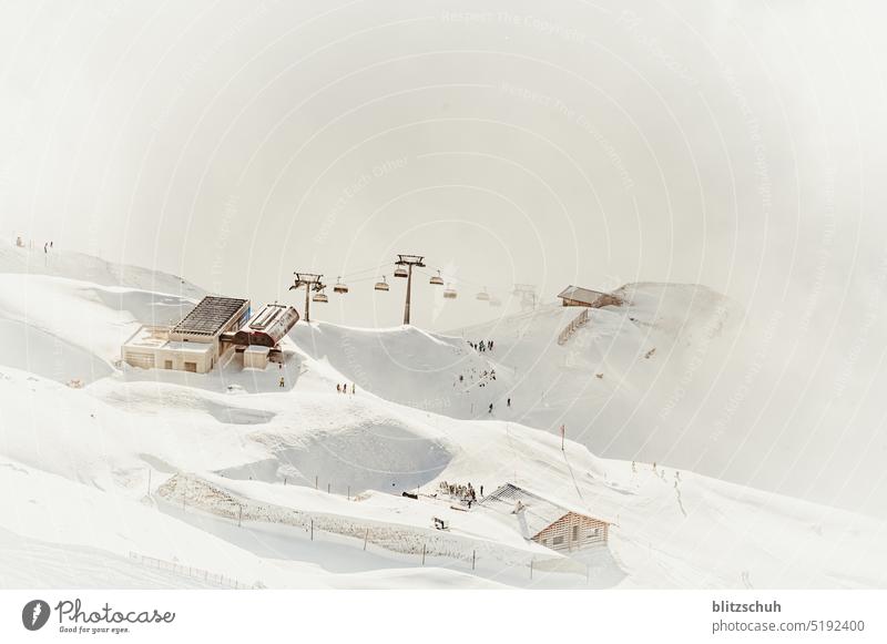 Lift station and restaurant above the fog means of transport open aperture blurriness mountains alps Swissalps Svizzera Leisure and hobbies Switzerland Grisons
