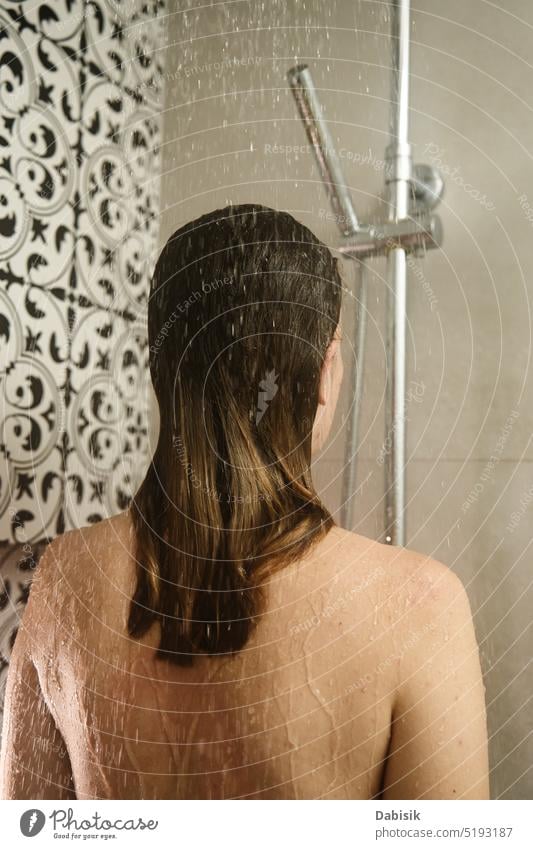 Back view of woman taking a shower in bathroom take back hair hygiene body head clean cabin shampoo washing candid care beauty caucasian enjoy female fresh girl