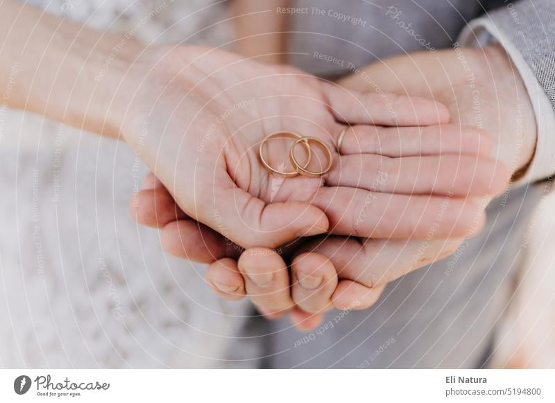 Young newly married couple showing their wedding rings, Stock Photo,  Picture And Rights Managed Image. Pic. F05-540184 | agefotostock