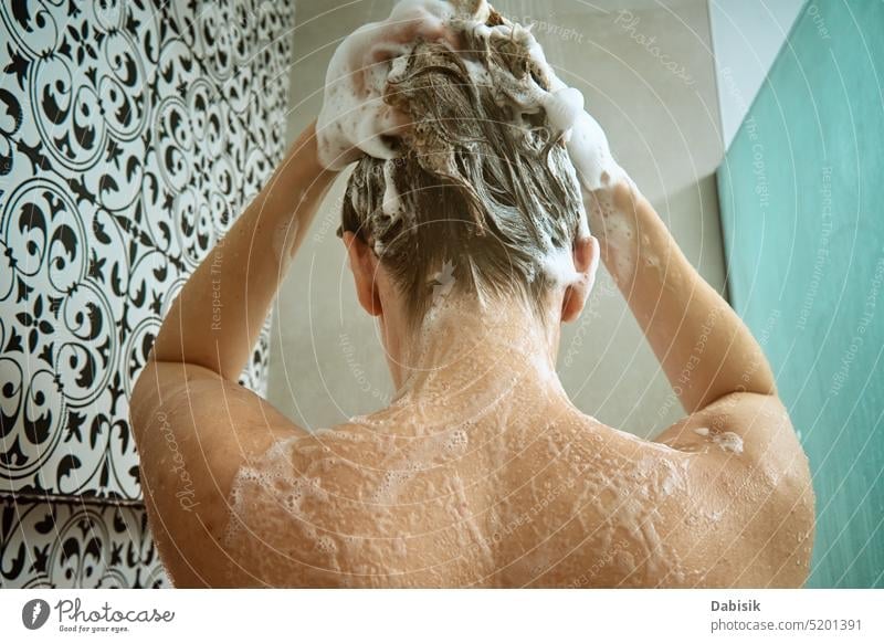 Back view of woman taking a shower in bathroom take back hair hygiene body head clean cabin shampoo washing candid care beauty caucasian enjoy female fresh girl