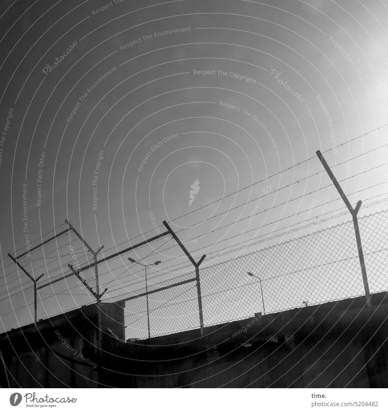 Enduring Story | Freedom & Security | Stories from the Fence .132 Barbed wire Tall Dark queasy Safety Protection Might faint Border lock Prison Prevention Sky