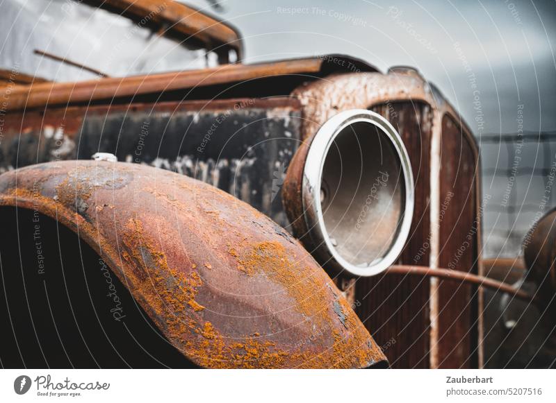 Old car rusts, symbolic of end of the combustion engine, end times, climate change corroded internal combustion engine Climate change electromobility Turnaround