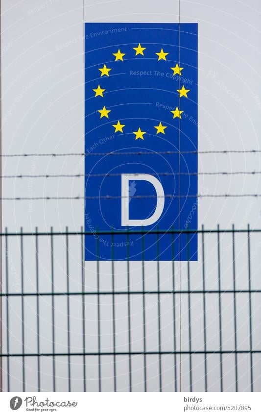 Eu - country code with a D for Germany behind a fence with barbed wire European Union EU identifier Sign symbol EU member Country code stars Blue Yellow White