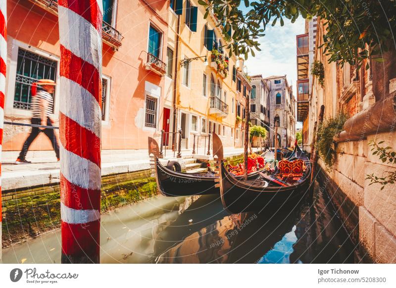 Gondolas boat floating in narrow canal of Venice city on beautiful sunny day. Italy. Europe italy gondolas venezia venice boats architecture landmark holiday